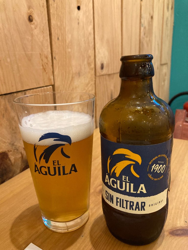 Enjoying an unfiltered beer (Aguila unfiltered) and a delicious premium hamburger in Valencia