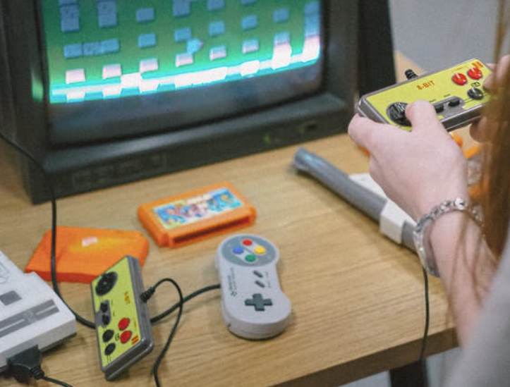 Person playing Vintage Nintendo Playstation