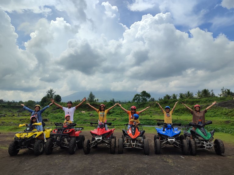 Group photo with Mt. Mayon covered with clouds in the background.