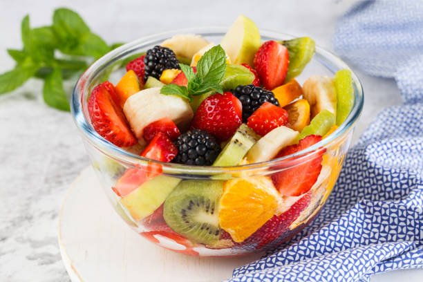 delicious-fruit-salad-on-a-plate-on-table-picture-id1298307574.jpg