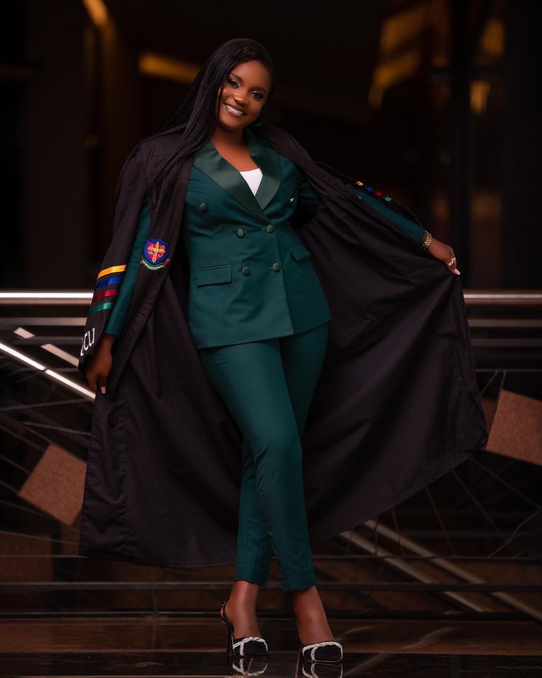 free-photo-of-young-elegant-woman-wearing-a-graduation-gown-and-smiling.jpeg