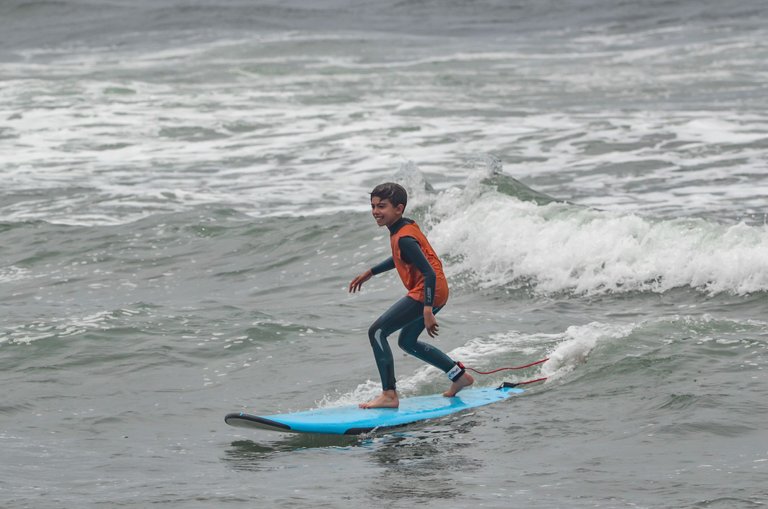 kid surfging small wave.jpg