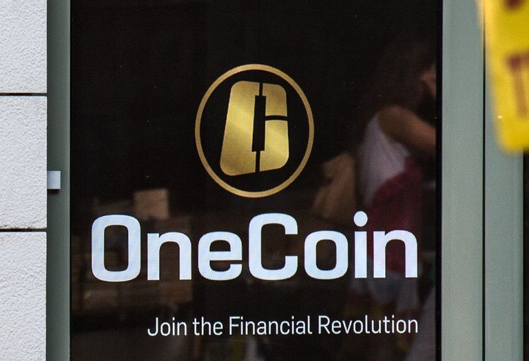 OneCoin_logo_on_their_office_door_in_Sofia,_Bulgaria.jpg