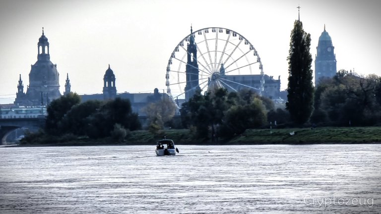 View across the Elbe to the Ferris wheel in front of the Old Town