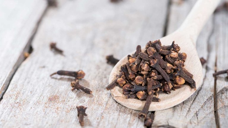 cloves-on-wooden-spoon-1296x728.jpg