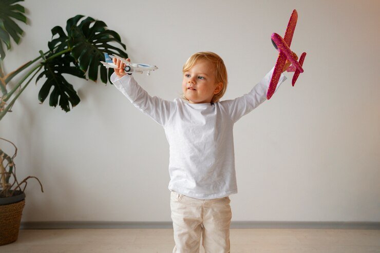 front-view-boy-playing-with-airplanes_23-2150182545.jpg