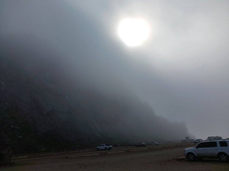 Sun trying to peak through the fog at Morro Rock.