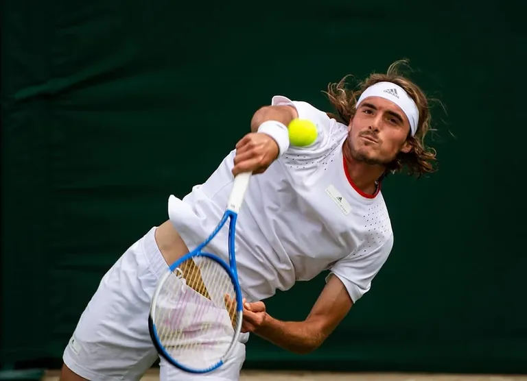 Stefanos-Tsitsipas-serving-at-Wimbledon.jpg.webp