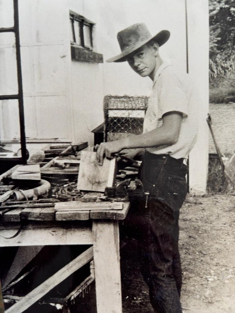 The Young Husband in one of his favourite places:  in front of a workbench