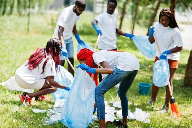 group-happy-african-volunteers-with-garbage-bags-cleaning-area-park-africa-volunteering-charity-people-ecology-concept.jpg