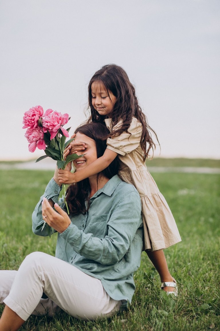 little-girl-presenting-flowers-her-mother.jpg