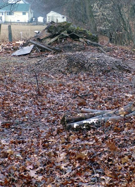 Behind barn - trash piles crop Feb. 2023.jpg