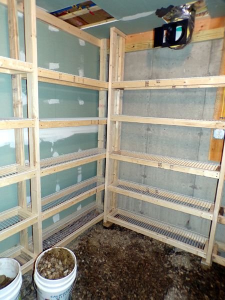 Construction- root cellar- shelving part finished crop Feb. 2023.jpg