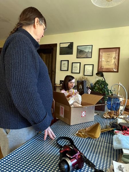 Pam, Hazel opening presents6 crop Feb. 2024.jpg