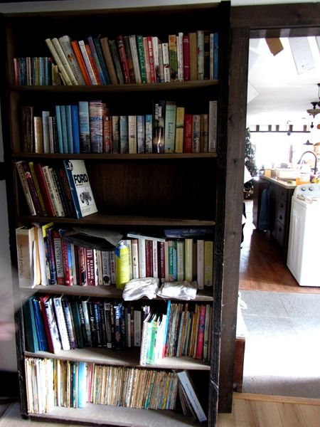 Cleaning the hall bookcase crop Jan 2025.jpg