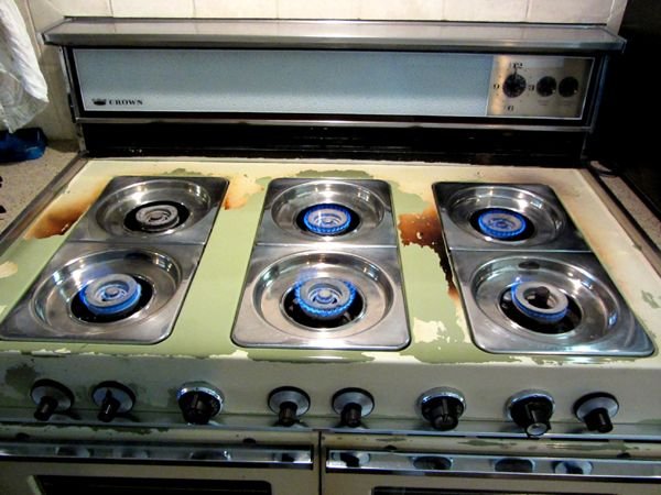 Cleaning the Cookstove - all burners light1 crop Jan 2025.jpg