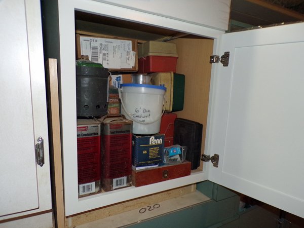 Fishing stuff in cabinet crop June 2022.jpg