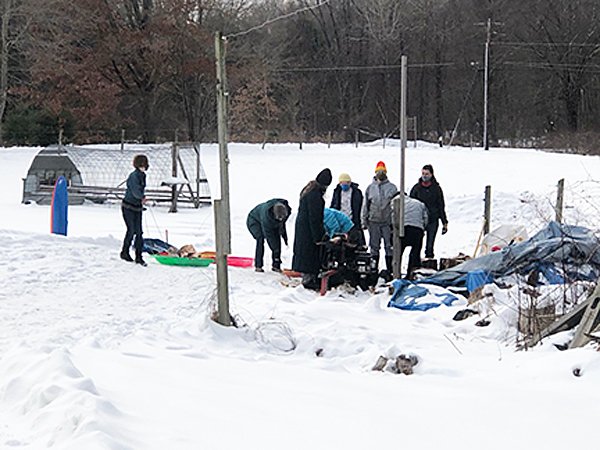 Friends splitting wood Feb. 2021.jpg