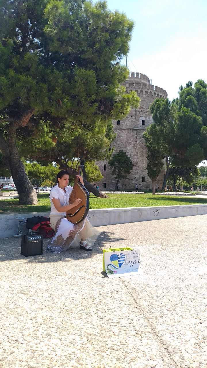 Tatyana play on the street near White Tower