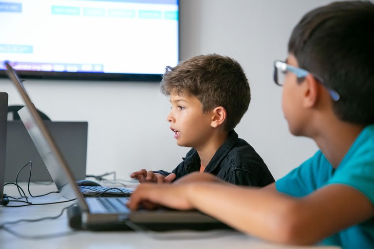 caucasian-boy-reading-task-aloud-lesson.jpg