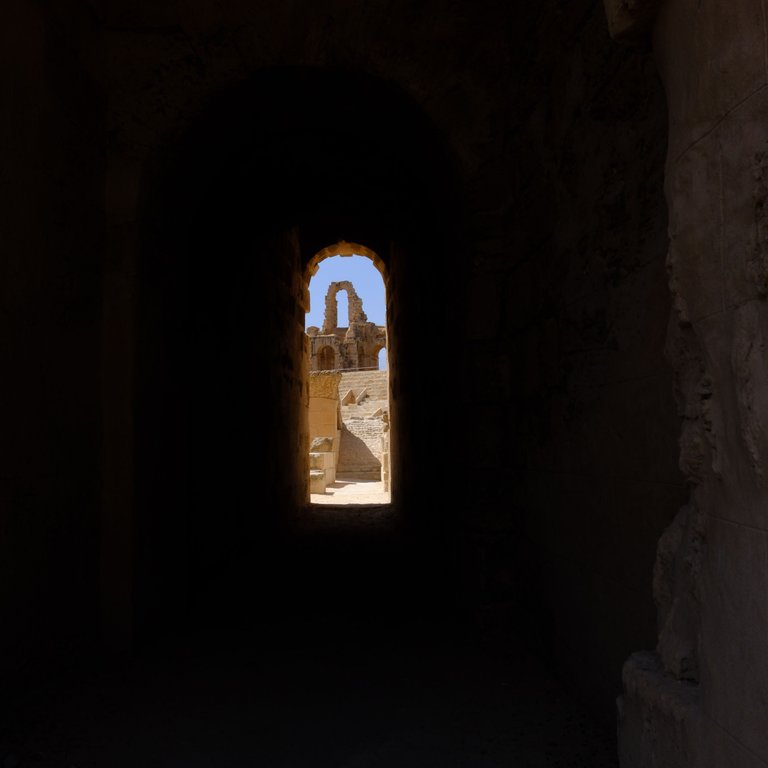 El Jem through the arch.jpg