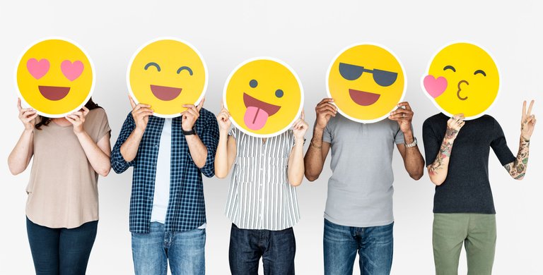 diverse-people-holding-happy-emoticons.jpg