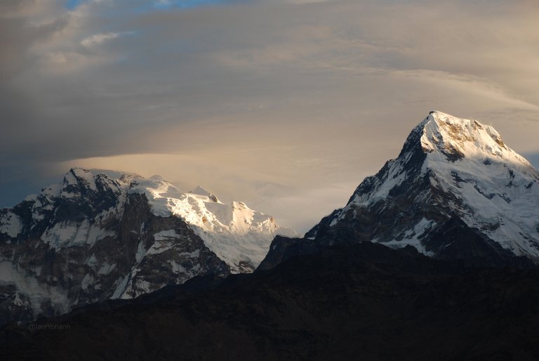 Sun rising over Annapurna South (7219m) and Hiunchuli (6441m)