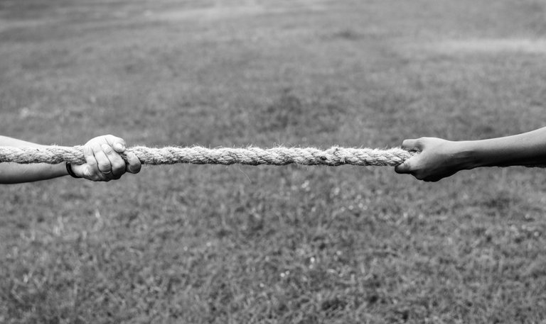 closeup-of-hand-pulling-the-rope-in-tug-of-war-game.jpg