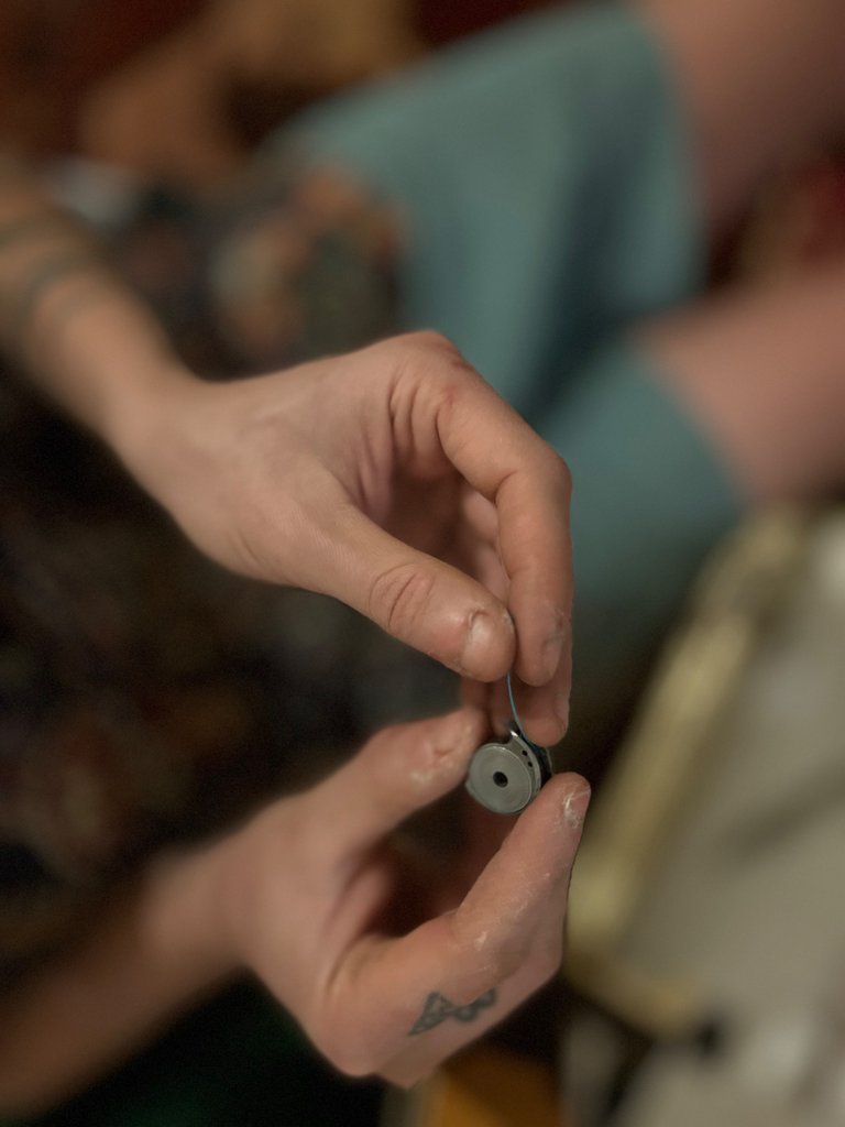 Bobbin inserted & now correctly threading it through the spring on the bobbin casing