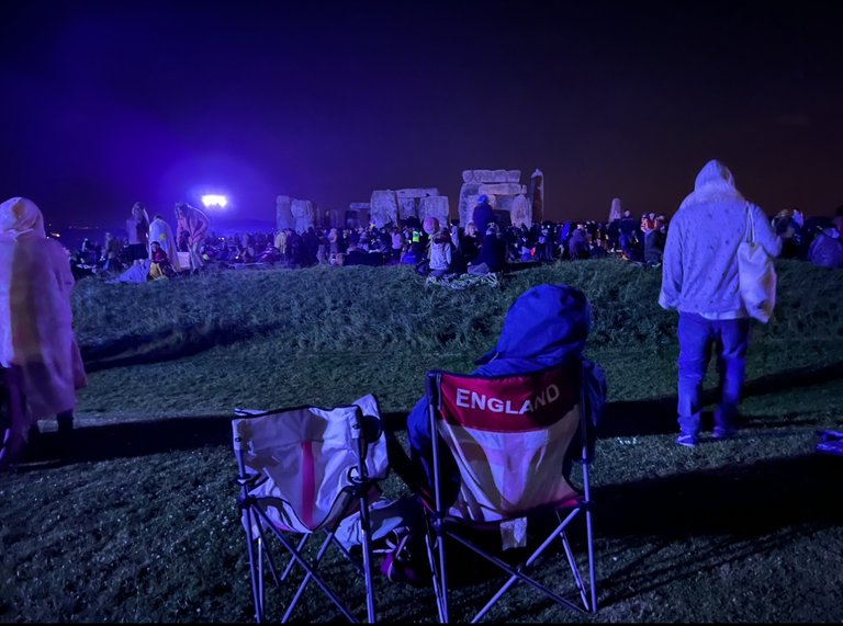 "My partner went to buy us popcorn, i hope he is not missing the great show", Summer Solstice, Stonehenge, UK, 2024