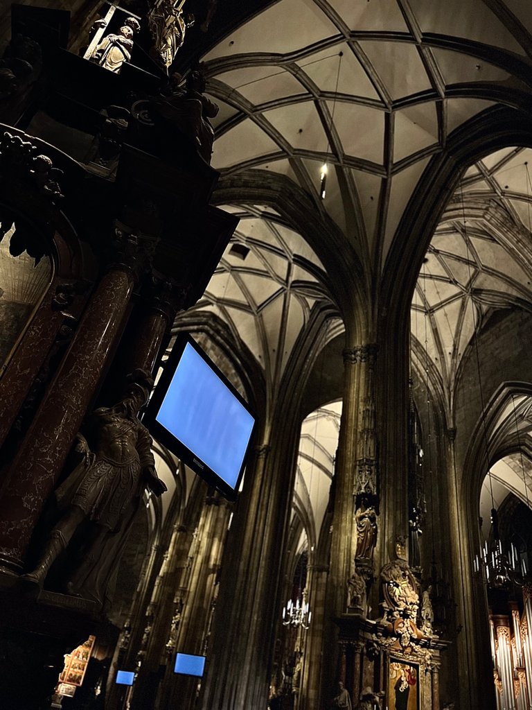 The Knight watching over the crowd under the TV, St. Stephen's Cathedral, Vienna, Austria, December 2023