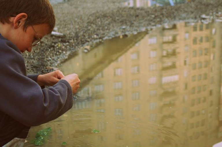 Adding Leaves on the puddle in order to bring luck for the next game, Baia Mare, Romania, 2011