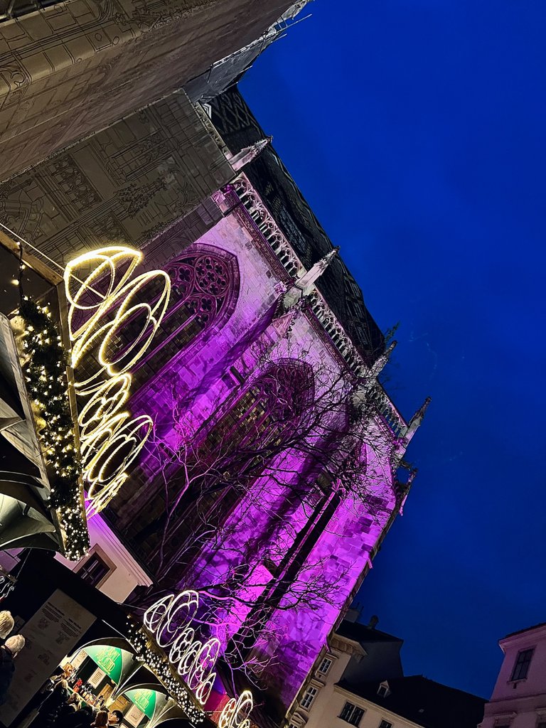 Lights of the Christmas Market upon the St. Stephen's Cathedral, Vienna, Austria, December 2023