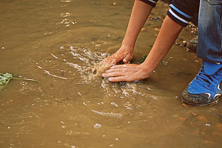 Dirty puddle still works as washing water, Baia Mare, Romania, 2011