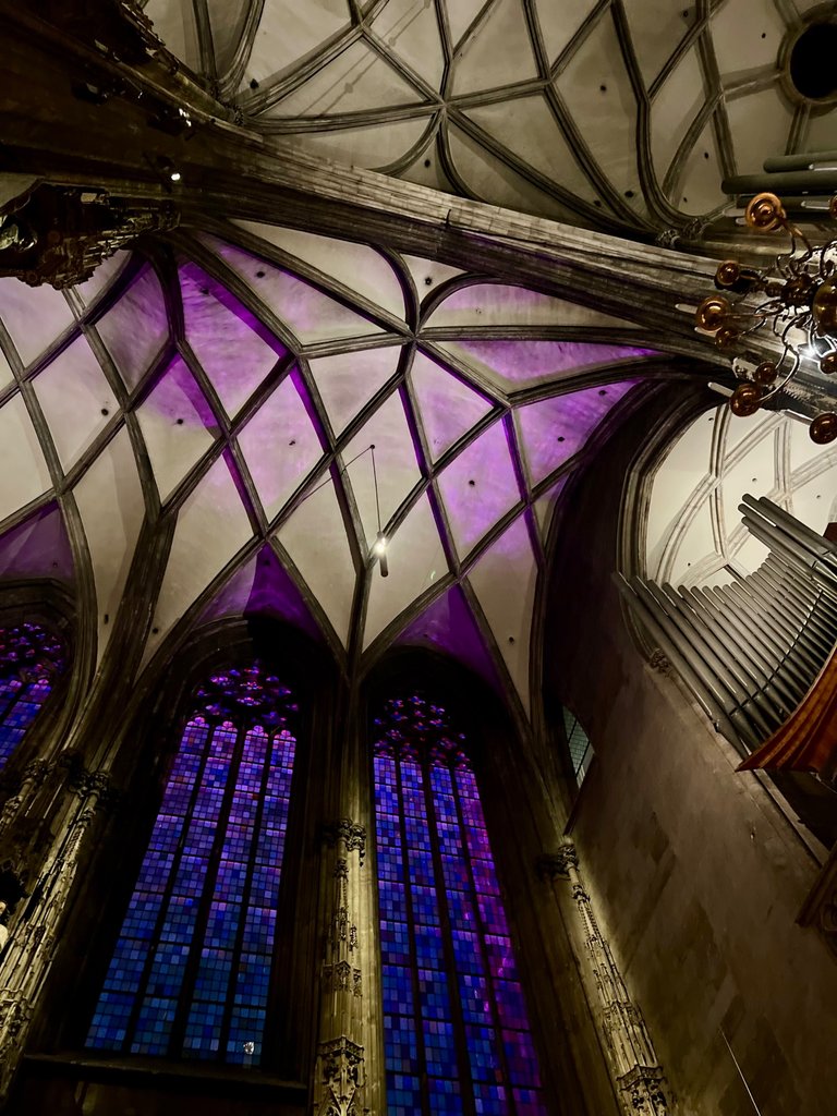 Stained Glass Windows and a part of the organ instrument at  St. Stephen's Cathedral, Vienna, Austria, December 2023 