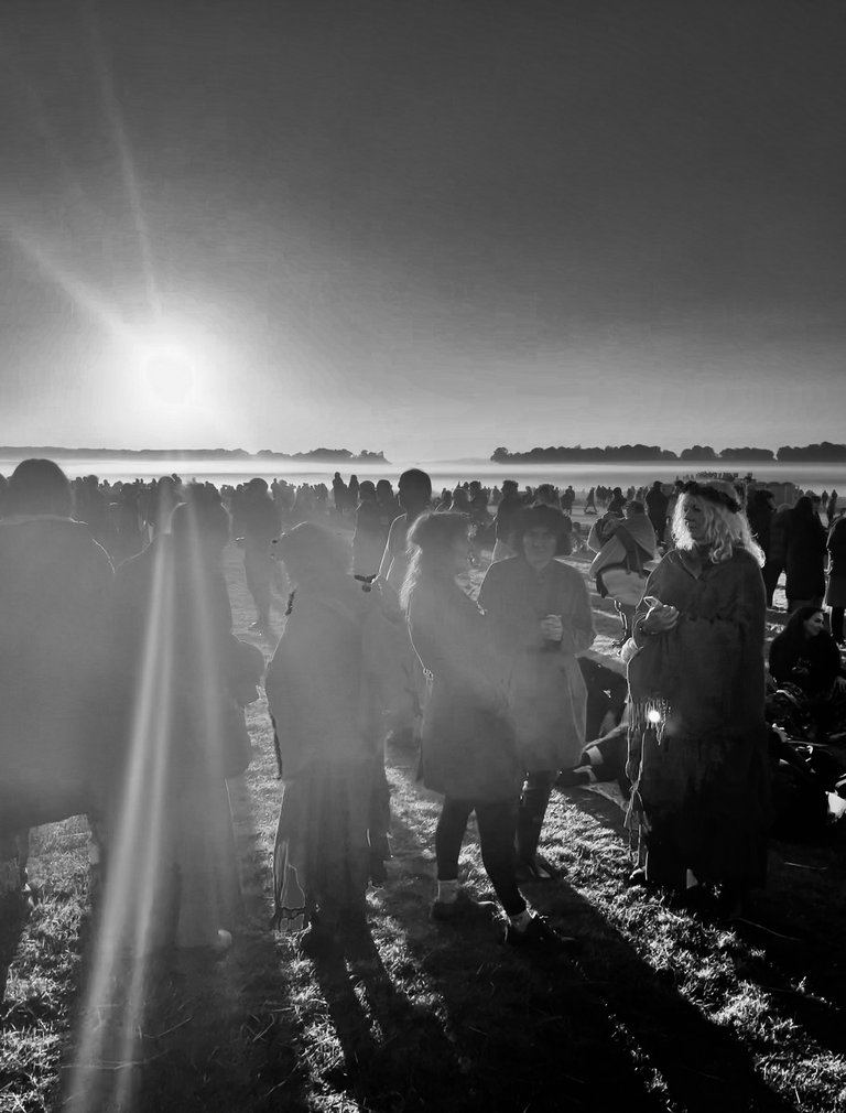 Team meeting / brainstorming before the sunset, Stonehenge, summer solstice, UK 2024 