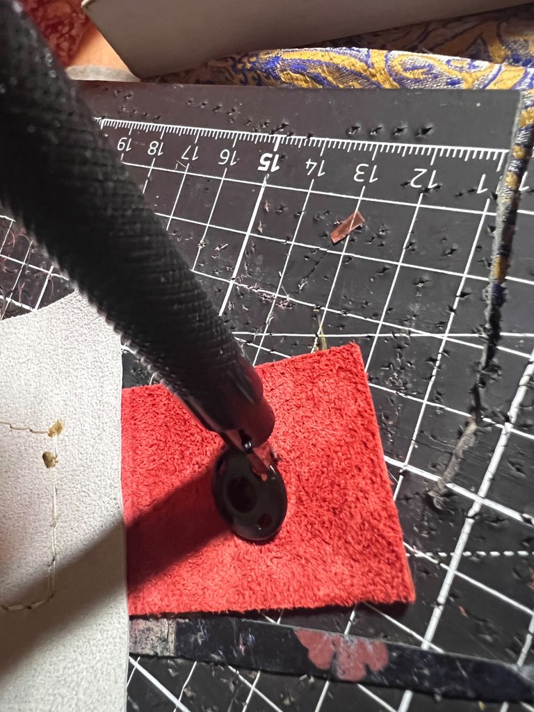 Poking the holes of the final part of the closing system