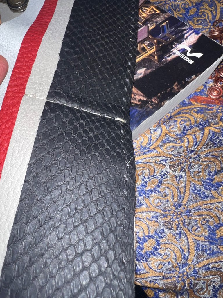 Inside the wallet, edge poked, two more to go