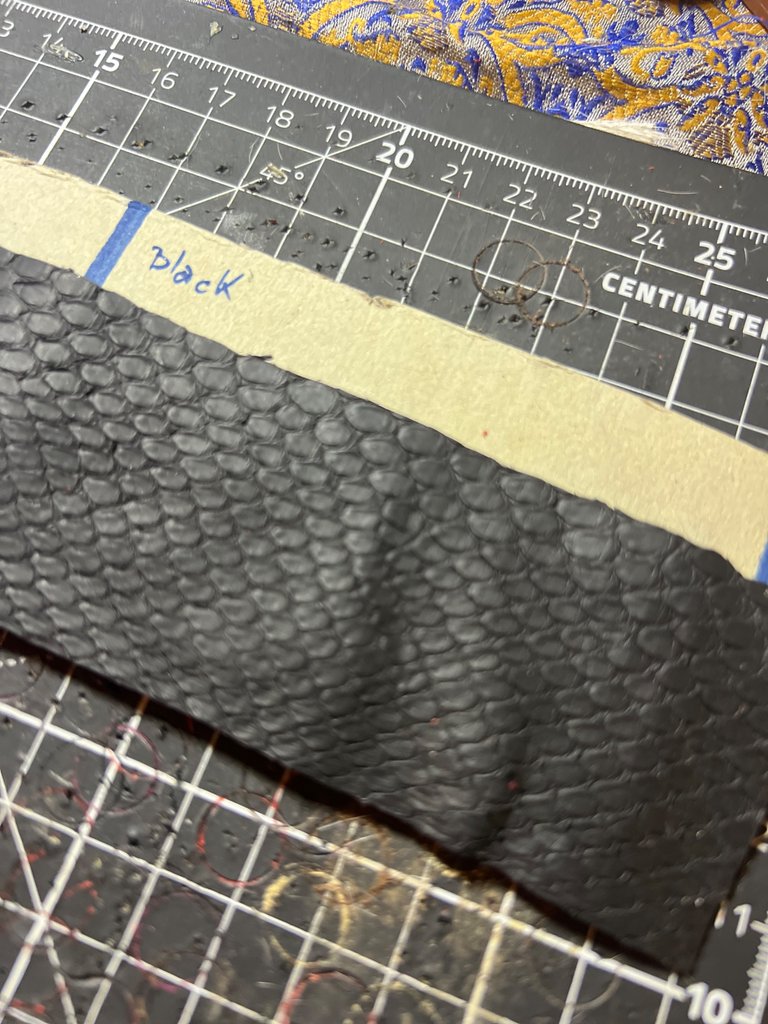 Black: The First Layer of Leather been cut according to the pattern: The Leather is Snake Skin :) 