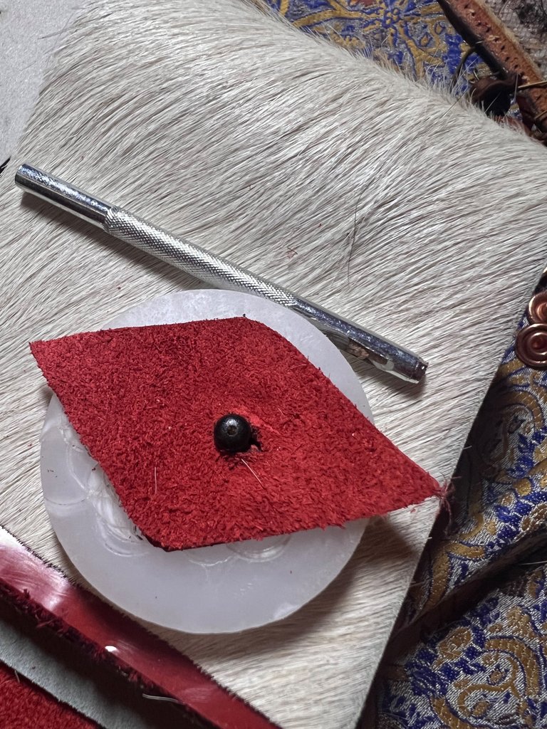 Back: Cut the hole for the closing system on the closing button:)