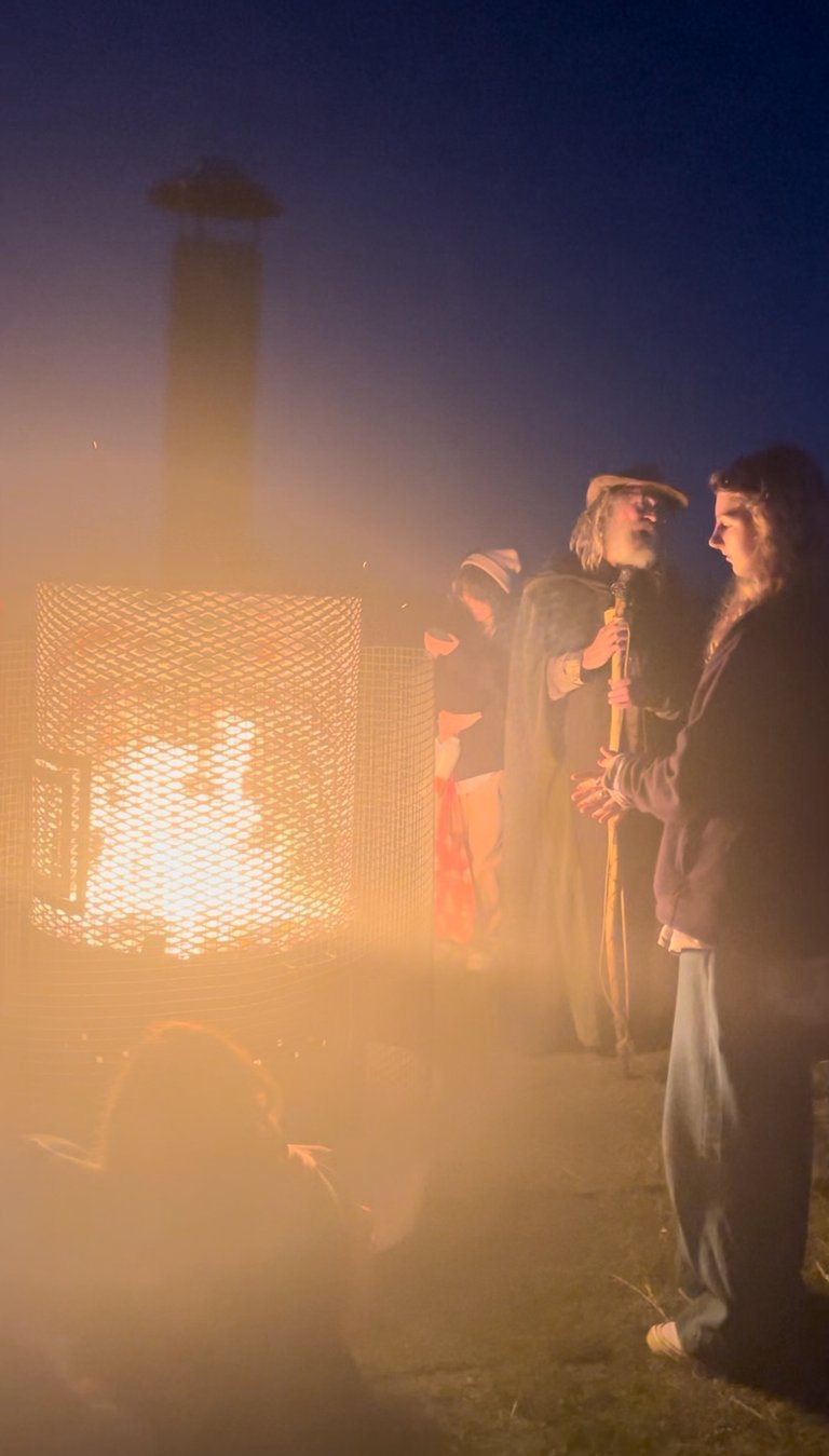 Druid Fire keeper and his assistant, Summer Solstice, Stonehenge, UK, 2024