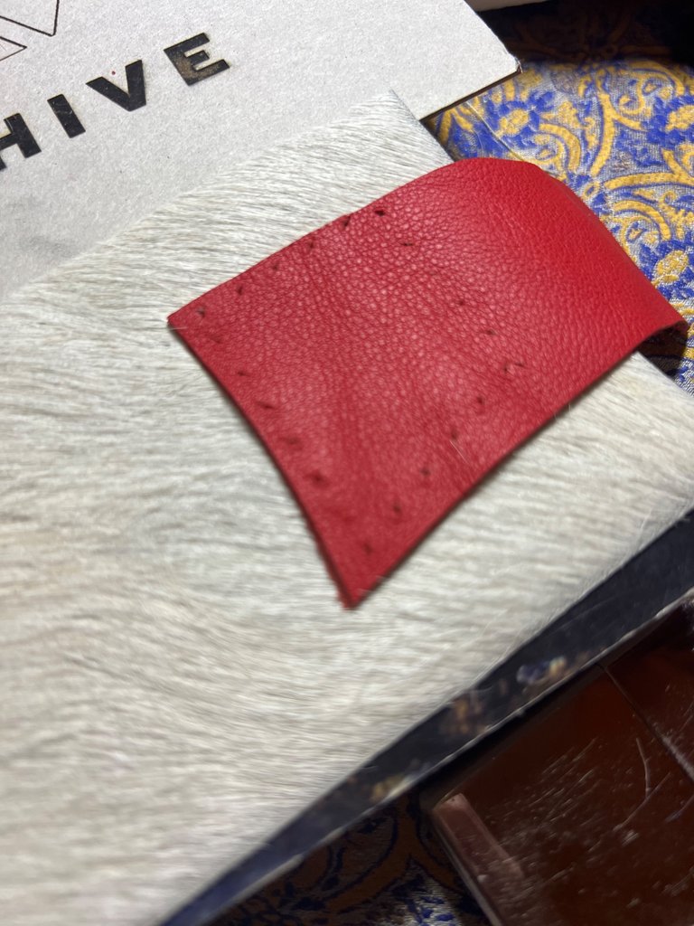 FRONT RED closing system Leather being poked Almost there
