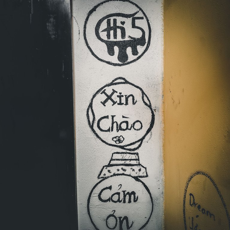 The hand-painted signs gives it a more local/warm feeling I think