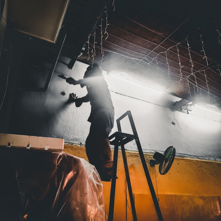 Here is the worker, finishing some painting