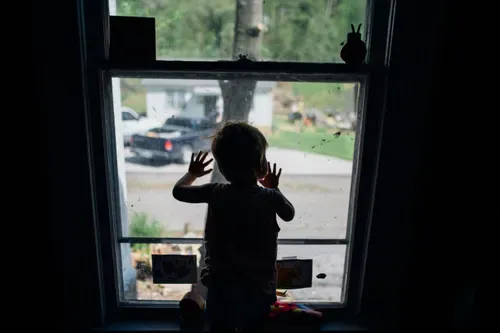 child-alone-window.webp