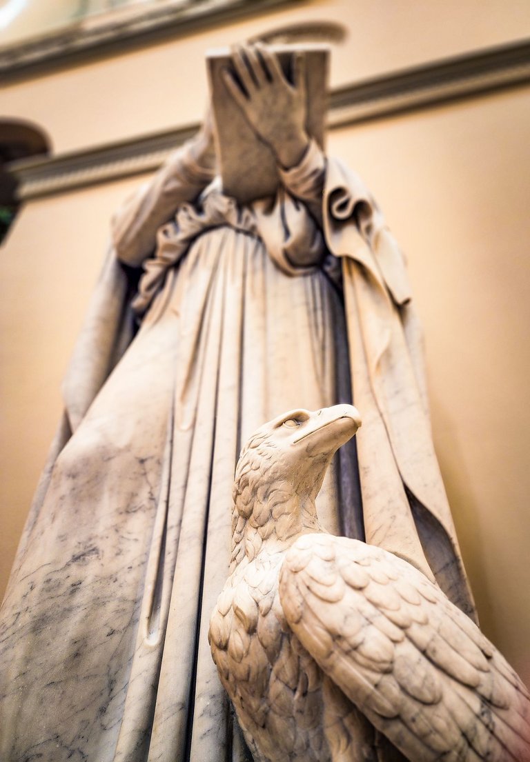 Statue of an apostle with an eagle beneath, located in the Church of Our Lady in Copenhagen