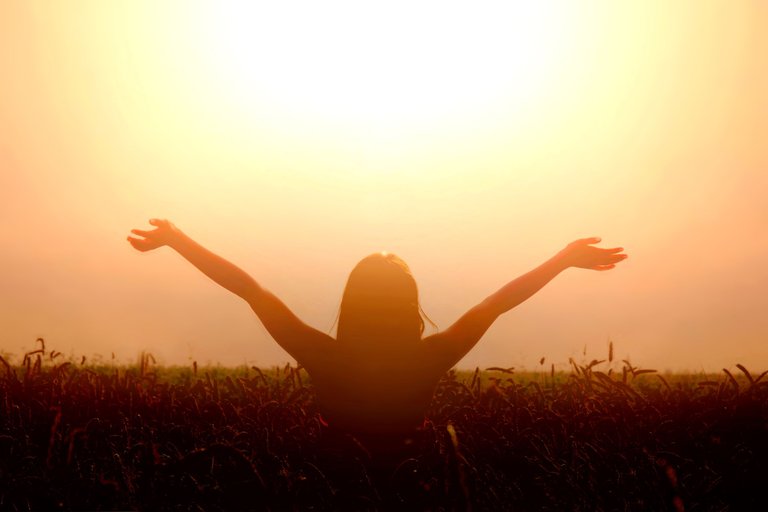 girl-lift-her-hands-to-the-sky-and-feel-freedom.jpg