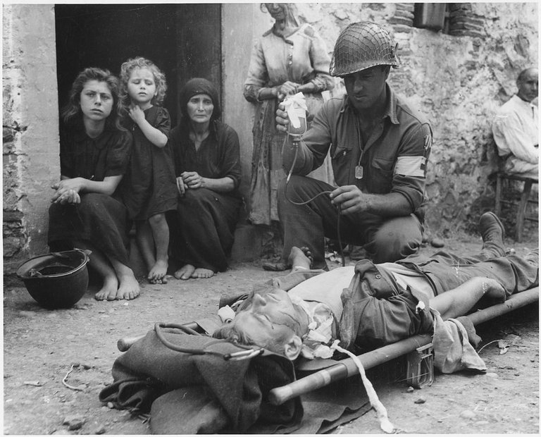 1115px-private_roy_w_humphrey_of_toledo_ohio_is_being_given_blood_plasma_after_he_was_wounded_by_shrapnel_in_sicily_on_8-9-43_-_nara_-_197268.jpg