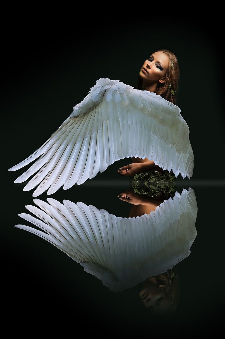 PxFuel-woman-with-white-wings-reflection-fantasy-portrait-beautiful.jpg