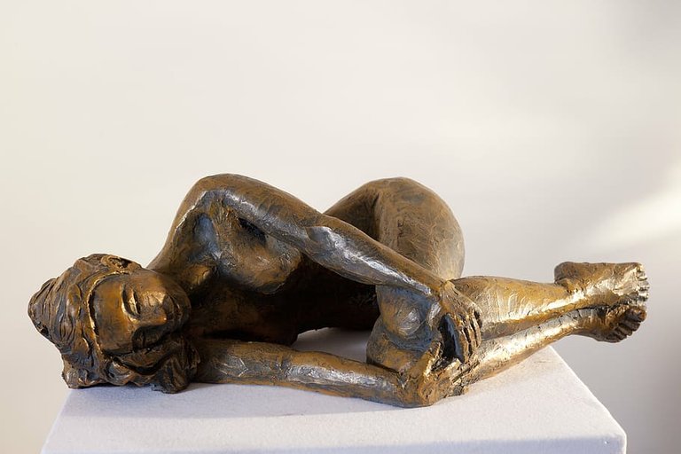 PxFuel-woman-lying-down-sculpture-india.jpg